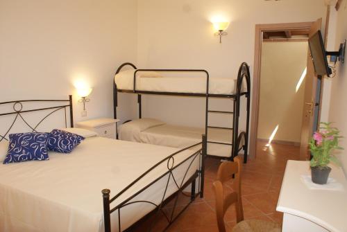 Katil atau katil-katil dalam bilik di A Casa di Nené