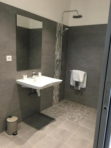 a bathroom with a sink and a mirror at La Villa Esponda in Saint-Jean-Pied-de-Port