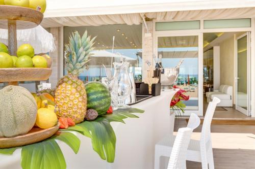 a display of fruits and vegetables on a counter at Hotel Bellariva in Lido di Jesolo