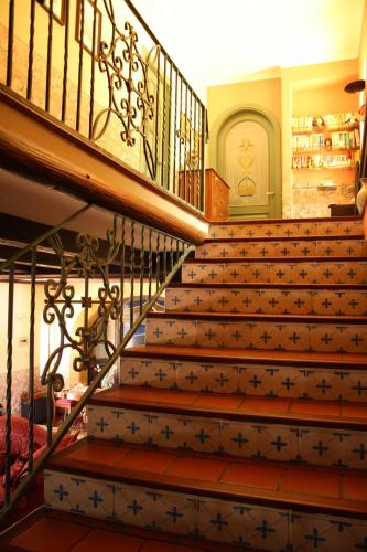 a staircase in a house with a stair case at Villa Clementine in Piazza Armerina