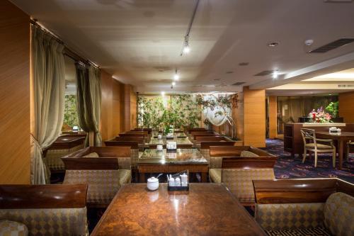 a row of tables and chairs in a restaurant at Waikoloa Hotel in Taipei