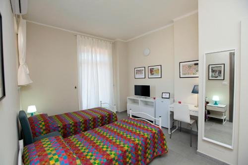 A bed or beds in a room at Albergo San Maurizio