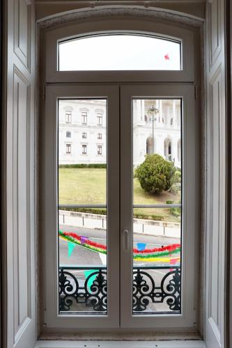 a window with a view of a building at Casas de São Bento in Lisbon