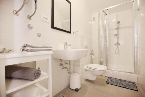 a bathroom with a sink toilet and a shower at Apartments Villa Navi in Bibinje