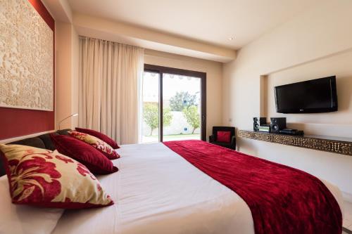 Ένα ή περισσότερα κρεβάτια σε δωμάτιο στο Villas Alondra