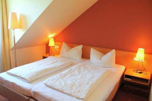 Ένα ή περισσότερα κρεβάτια σε δωμάτιο στο Hotel und Restaurant Eurohof