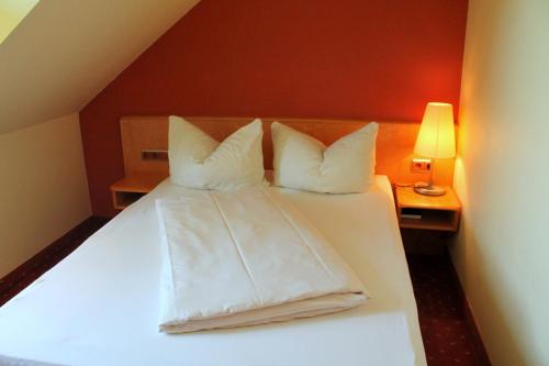 Ένα ή περισσότερα κρεβάτια σε δωμάτιο στο Hotel und Restaurant Eurohof