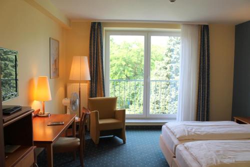 En eller flere senger på et rom på Hotel und Restaurant Eurohof