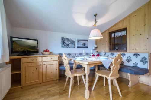a dining room with a table and chairs at Huaterhof in Zell am Ziller