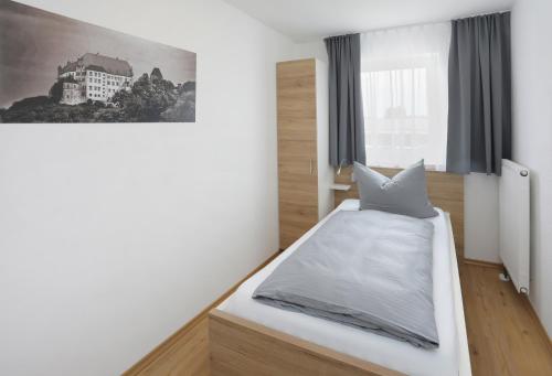Uma cama ou camas num quarto em easy sleep Apartmenthotel