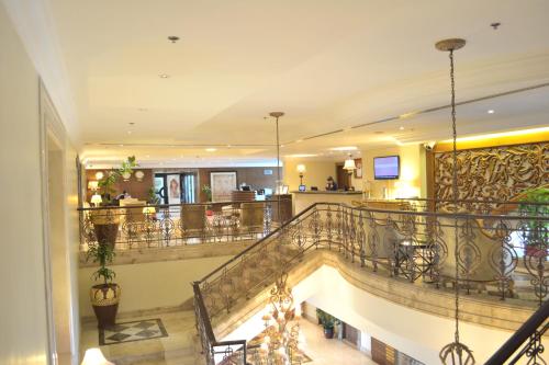 a staircase in a building with a lobby at Khalidiya Hotel in Abu Dhabi