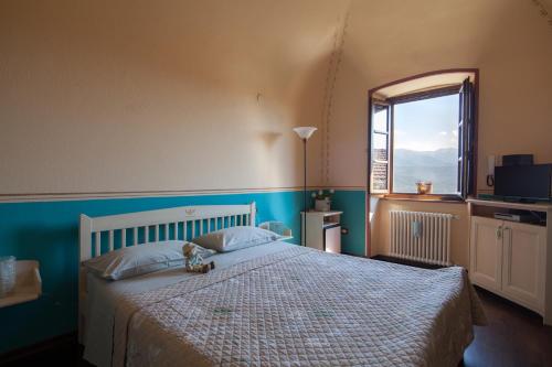 Postel nebo postele na pokoji v ubytování B&B La Pulce Dorata