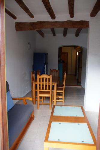 a living room with a couch and a table at Apartment Cal Viola in Torroja