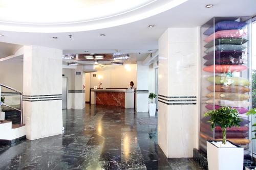 a lobby of a building with a glass wall at Dorian Inn - Sure Hotel Collection by Best Western in Athens