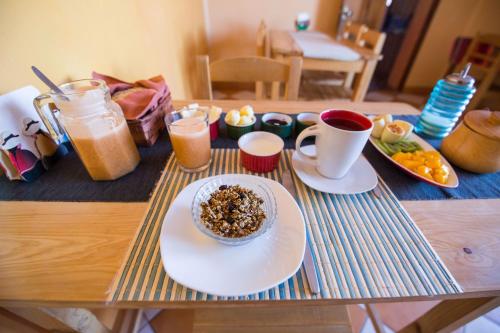 a table with a plate of food and drinks on it at La Selenita in Sucre