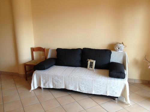 Postel nebo postele na pokoji v ubytování Buggerru a Mare Residence