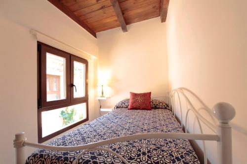 Posteľ alebo postele v izbe v ubytovaní Apartamentos Alcantara