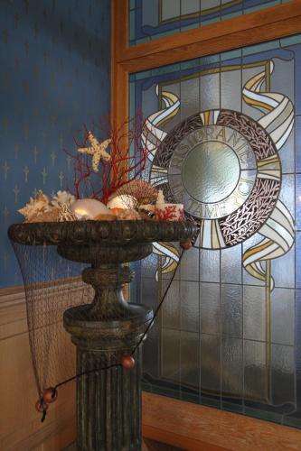 a stone table with a plate on top of it at Hotel Promenade in Montesilvano