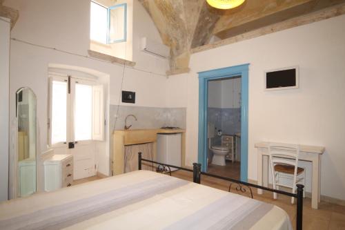 Postel nebo postele na pokoji v ubytování Appartamento la Corte Azzurra