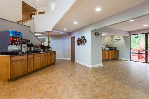 a large room with a kitchen with a counter at Days Inn by Wyndham Chincoteague Island in Chincoteague