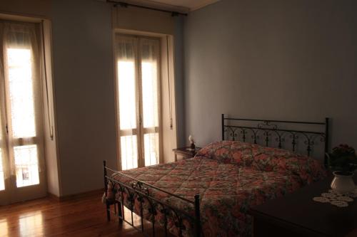 Ένα ή περισσότερα κρεβάτια σε δωμάτιο στο B&B Rosa Apartment