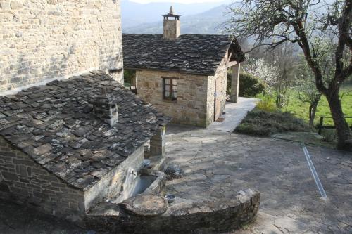 an old stone building with a fireplace in front of it at Ca' d'Alfieri in Bardi