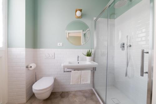 a bathroom with a toilet and a sink and a shower at AleMar Sirolo in Sirolo