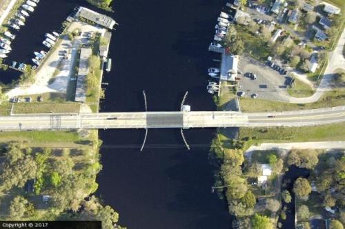 an aerial view of a bridge over the water at Big River Marina & Lodge in Astor