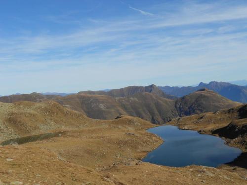 a view of a mountain with a lake in the foreground at Ferienhaus Enzi in Weissbriach