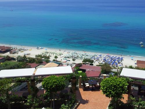 a view of the beach from a resort at Hotel Rocca Della Sena in Tropea