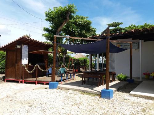 a playground with a tent and a picnic table at Cabanas Recreaciones in Coveñas