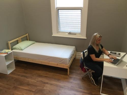 A bed or beds in a room at Cozzystay Accommodation