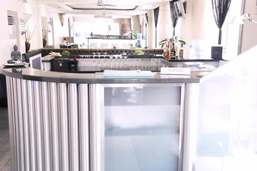 a kitchen with a large counter with a counter top at Business Wieland Hotel in Düsseldorf