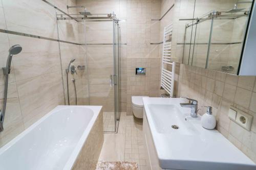 Ванная комната в Apartamentai Voveraite
