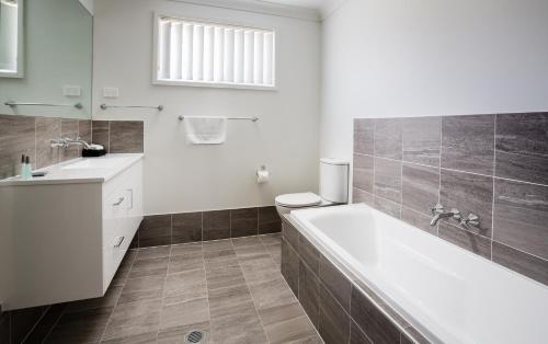 Ένα μπάνιο στο Wallsend Executive Apartments