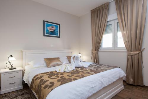 Posteľ alebo postele v izbe v ubytovaní Apartments Villa Stella