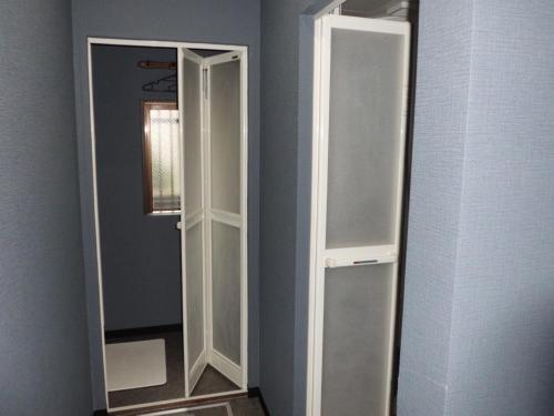 a closet with two mirrors in a room at Sumiya Spa & Hotel in Hiroshima