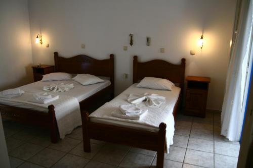 Postel nebo postele na pokoji v ubytování Hotel Landeris