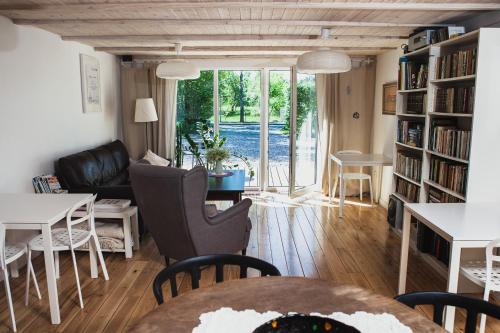 a living room with a couch and a table at SAKÀ Vacation House in Druskininkai