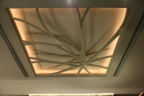 a ceiling with a large metal design on it at Sohotel in Hong Kong