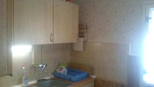 a small kitchen with a sink and a sink at All-Inn K&ouml;re in Kisk&ouml;re