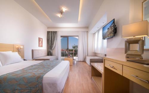 A bed or beds in a room at Flegra Palace