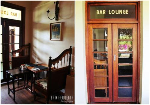a restaurant with a door and a bar lounge at Ripple Hill Hotel in Patensie