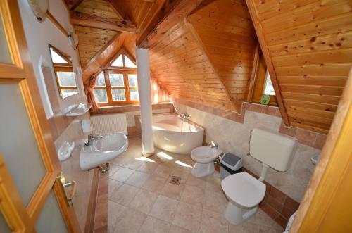 an overhead view of a bathroom with two toilets and a tub at Castle house in Balatonfüred