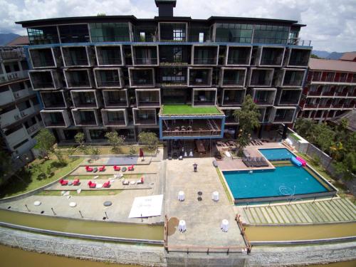 an aerial view of a hotel with a swimming pool at Inthira Vangvieng in Vang Vieng
