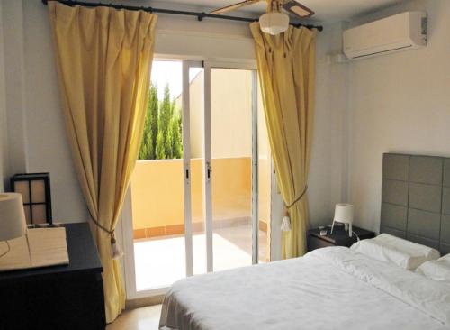 Ein Bett oder Betten in einem Zimmer der Unterkunft Apartament in Paraiso de la Bahia