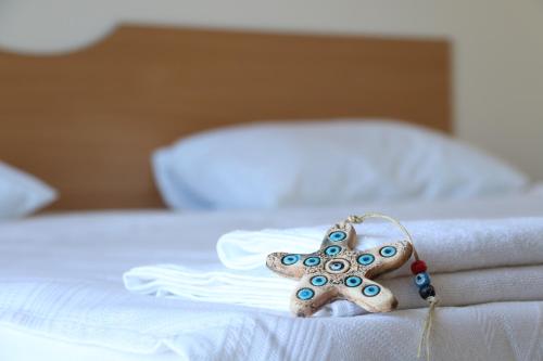 a starfish is sitting on top of a bed at Persani Sunny Beach in Sunny Beach