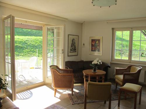a living room with a couch and a table at B&B Sigrid Braun-Budde in Bettingen