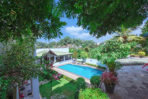 an aerial view of a house with a swimming pool at Kaya Residence Kandy in Kandy