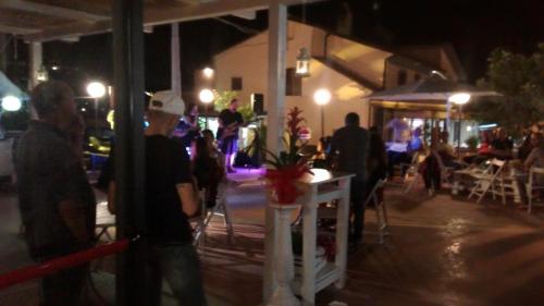 a group of people standing in a street at night at Locanda del Principe in Soriano nel Cimino